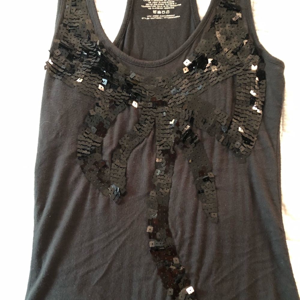 Black tank top with beaded bow.